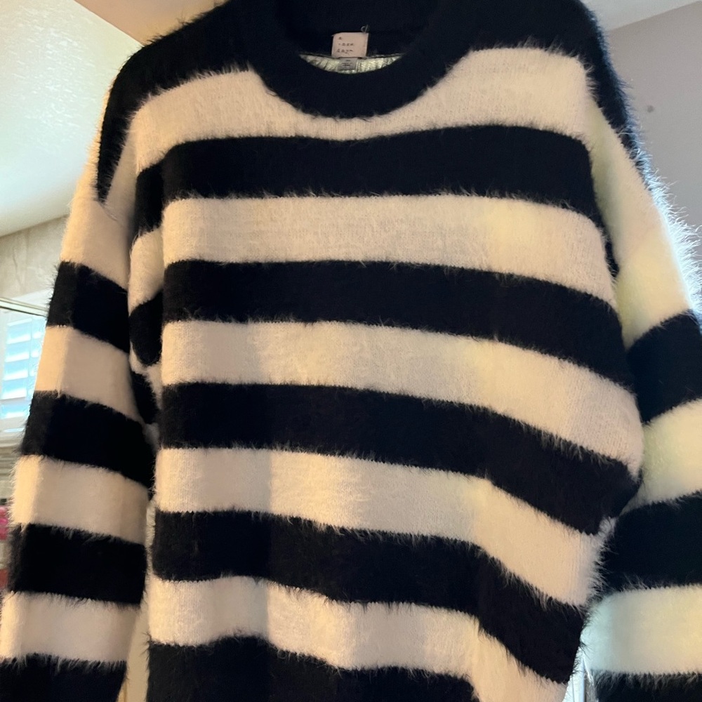 Long sleeve sweater.  Cozy & soft.  Black and white stripes.  Never been worn.